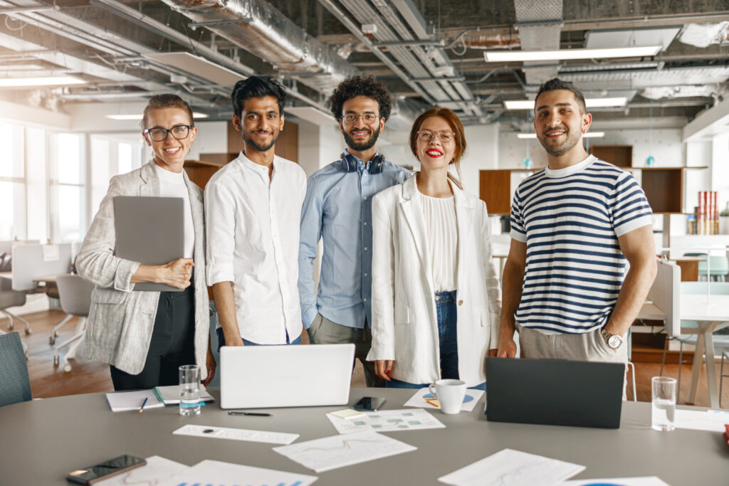 Diverse group of colleagues enjoying working together in an office. Teamwork concept