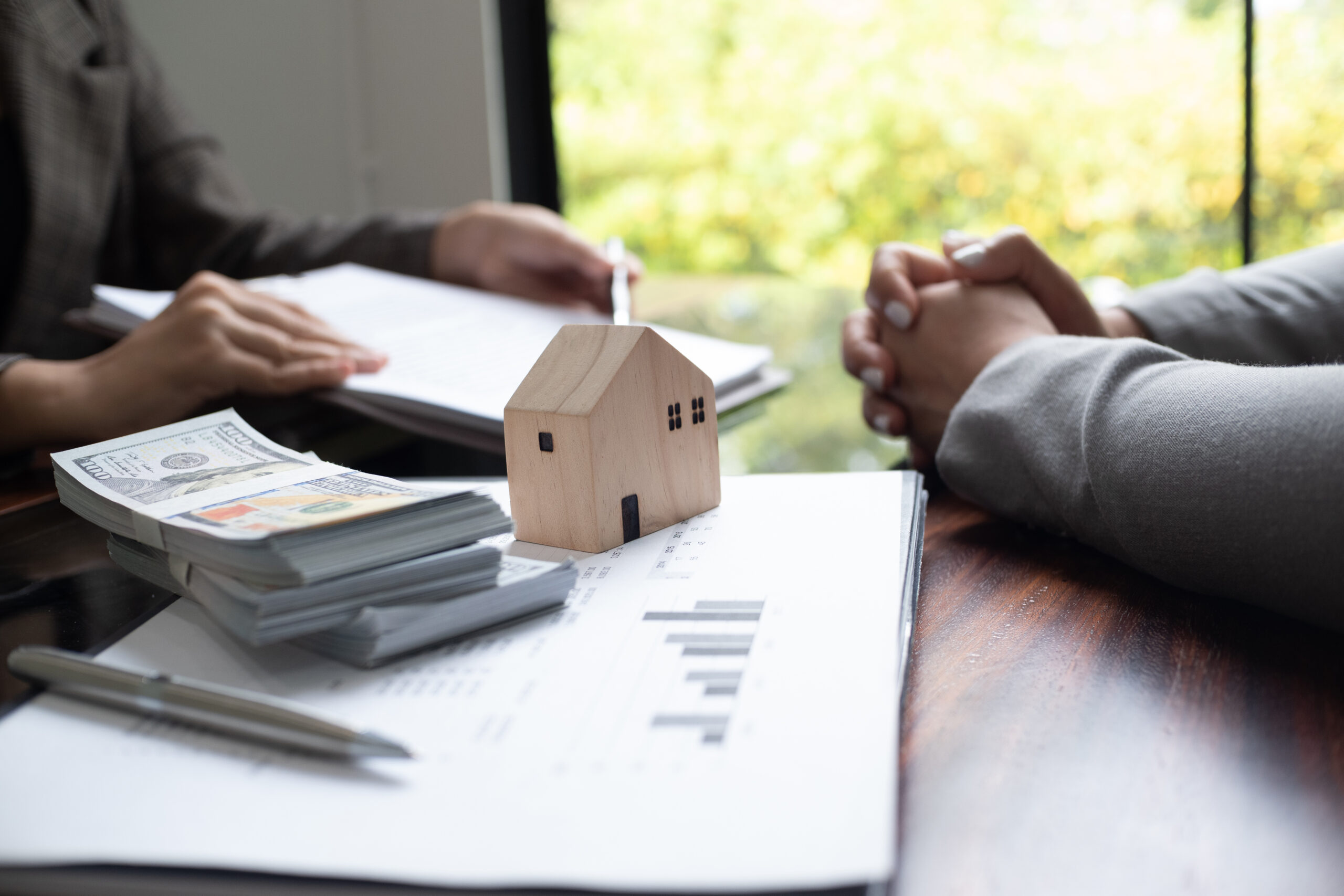 Real estate agent presenting and approved home loan contract. Re